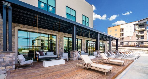 Lounging By The Pool at Soleil Lofts Apartments, Herriman, UT - Photo Gallery 1