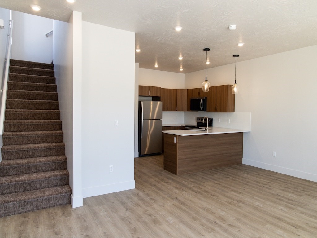 Stairs by Kitchen at The Ash Apartments & Townhomes