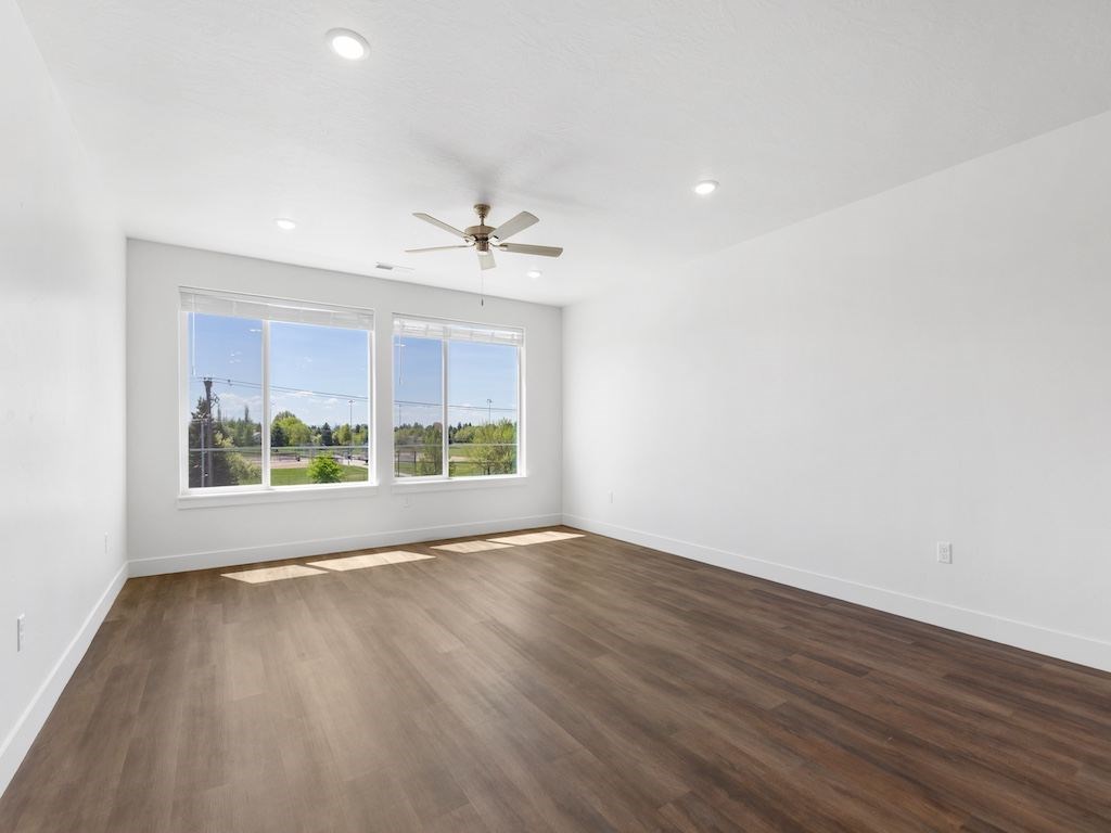 The Grove at Orchard Park Living Room with Ceiling Fan