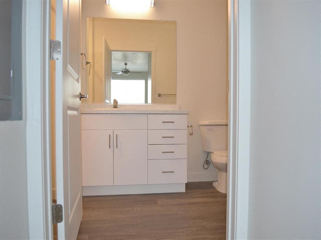 Modern Bathroom with White Cabinets at Kimpton Square Senior Apartments