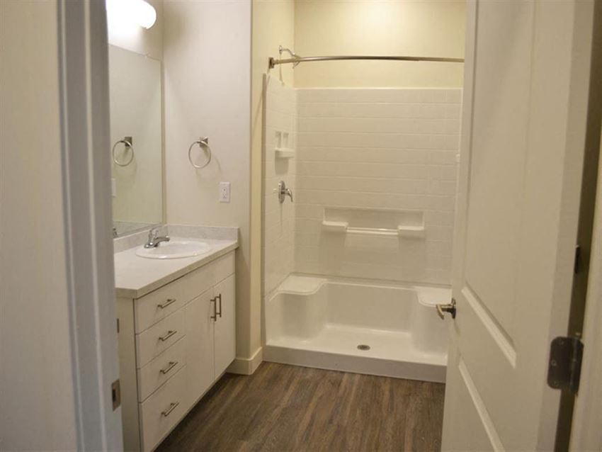 Main Bath with Walk-in Shower Main Bath with Walk-in Shower at Kimpton Square Senior Apartments - Photo Gallery