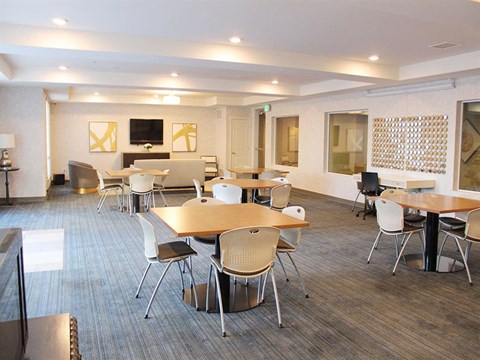 Resident Lounge with Sitting Area & TV at Kimpton Square Senior Apartments