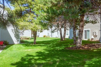Green Spaces With Mature Trees at Devonshire Court Apartments & Townhomes, Utah - Photo Gallery 20