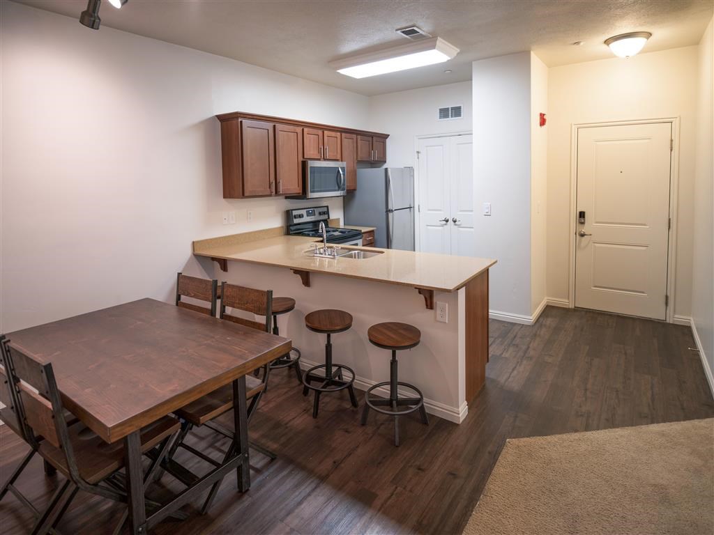 Dining Room and Kitchen View at Four Seasons Apartments & Townhomes, Utah, 84341