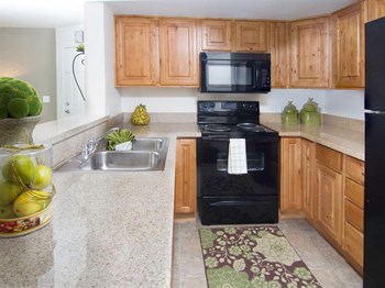 Modern Kitchen With Custom Cabinet Modern Kitchen With Custom Cabinet at Promontory Point Apartments, Sandy, UT, 84094 - Photo Gallery 4