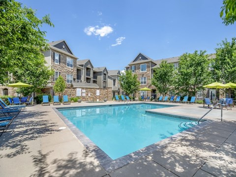 our apartments offer a swimming pool with chairs and umbrellas