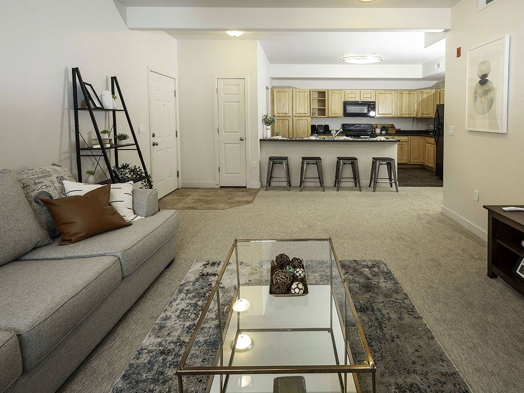 Open Living Room with Kitchen View at Four Seasons at Southtowne Apartments, South Jordan, UT, 84095