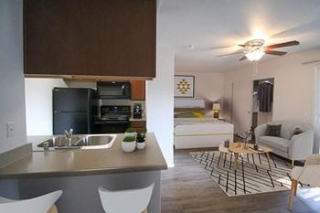 Living Room with Kitchen View Living Room with Kitchen View at Eucalyptus Grove Apartments, California - Photo Gallery 5