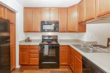 Electric Range In Kitchen Electric Range In Kitchen at Eucalyptus Grove Apartments, Chula Vista, CA, 91910 - Photo Gallery 3