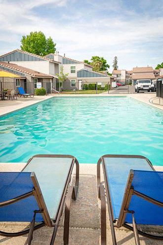 Poolside Relaxing Area at River Oaks Apartments & Townhomes, Hanford, 93230
