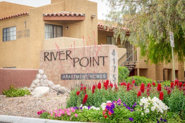 Decorated Entry Signage with Flowers at River Point Apartments, Tucson, AZ, 85712 - Photo Gallery 1