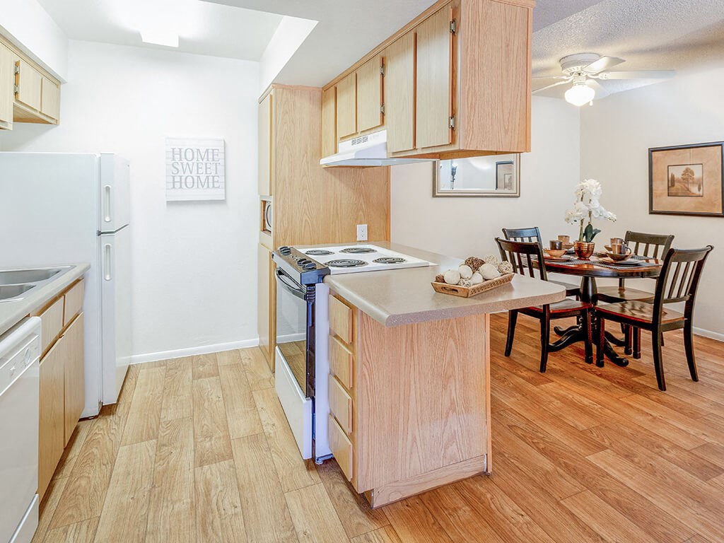 open concept kitchen with light wood cabinetty at Glen Oaks Apartments, Glendale, AZ 85301