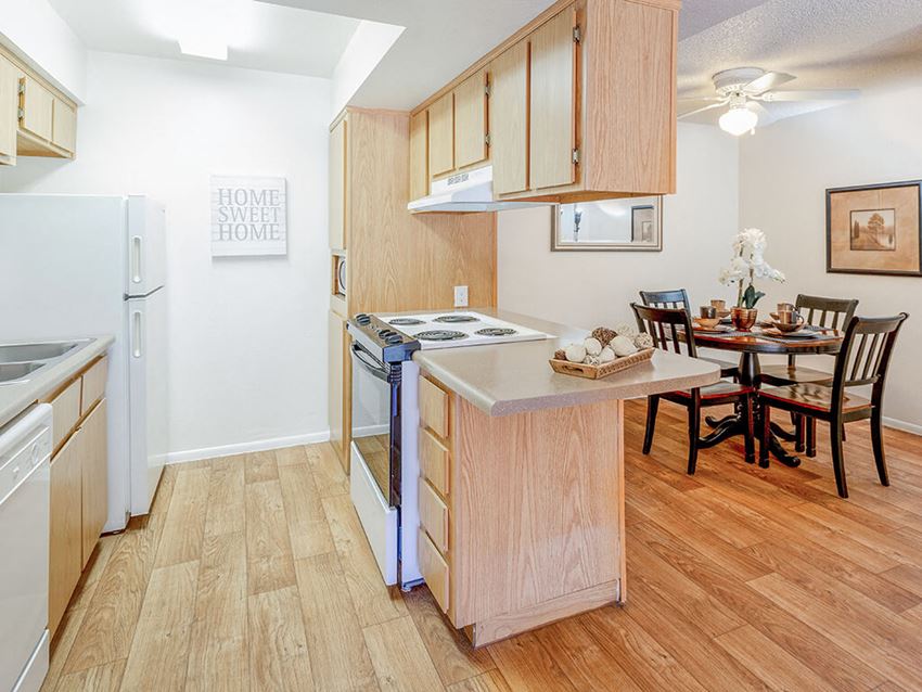 Open Concept Kitchen & Dining Area open concept kitchen with light wood cabinetty at Glen Oaks Apartments, Glendale, AZ 85301