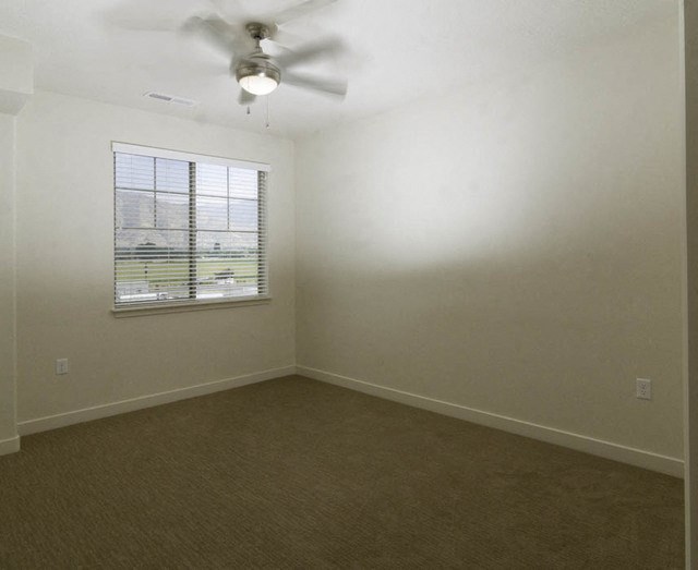 Bedroom with Ceiling Fan at Four Seasons Apartments & Townhomes, North Logan, UT, 84341