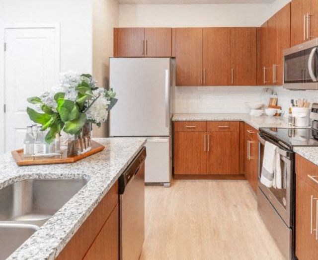 Kitchen with wooden closet at Parc on 5th Apartments & Townhomes, American Fork