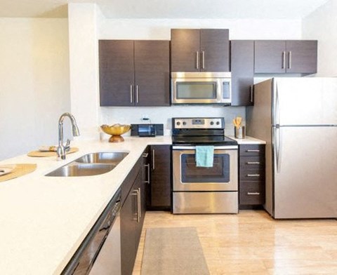 a kitchen with stainless steel appliances and a sink