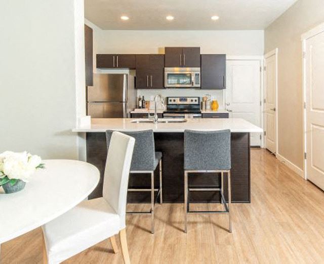 Eat-In Kitchen Table With Sink Eat-In Kitchen Table With Sink at Parc on Center Apartments & Townhomes, Orem, UT, 84057 - Photo Gallery