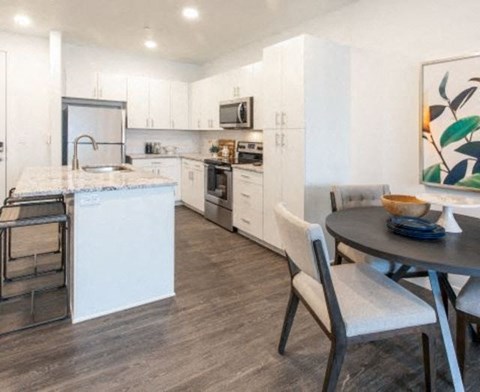 Kitchen with Woodgrain Floor at Parc View Apartments & Townhomes, Utah, 84047