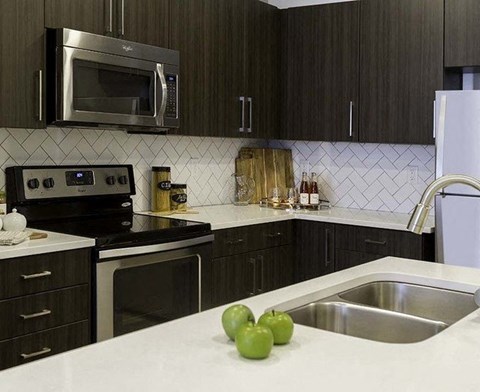 a kitchen with a sink and a microwave
