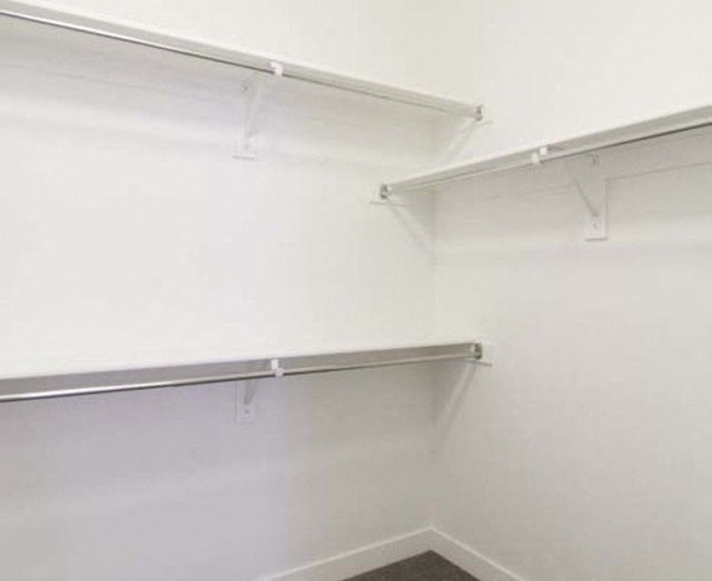 Walk-In Closets With Built-In Shelving at Parc West Apartments, Draper, Utah