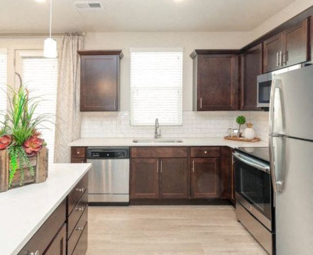 Stainless Steel Refrigerator And Kitchen Appliances Refrigerator And Kitchen Appliances at Rivulet Apartments, Utah