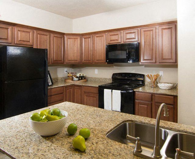 Fully Equipped Kitchen With Modern Black Appliances Fully Furnished Kitchen With Stainless Steel Appliances at San Marino Apartments, Utah, 84095