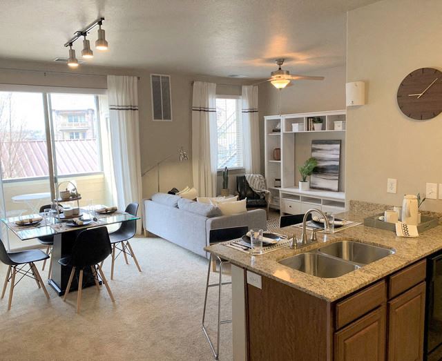 Living Room With Kitchen View Living Room With Kitchen View at San Marino Apartments, South Jordan, UT, 84095