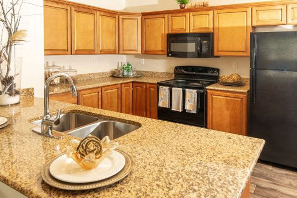 Granite Counter Tops In Kitchen at San Moritz Apartments, Midvale, UT