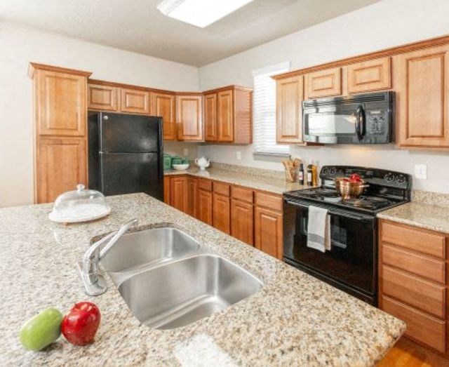 Gourmet Kitchen With Island at San Tropez Apartments & Townhomes, South Jordan