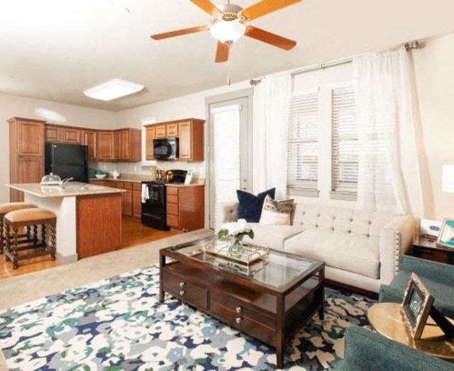 Living Room with Kitchen View at San Tropez Apartments & Townhomes, Utah