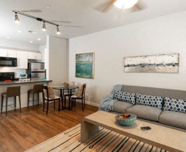 Woodgrain Floor Living Room at San Tropez Apartments & Townhomes, Utah, 84095