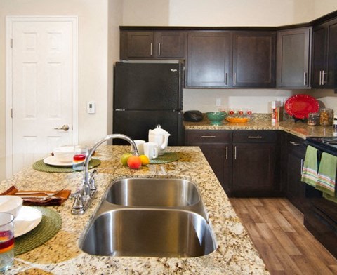 a kitchen with a sink and a counter top