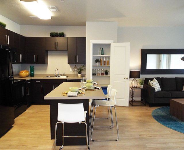 Island Kitchen and Open Living Space Island Kitchen and Open Living Space at Enclave at 1400 South Apartments, Salt Lake City, UT