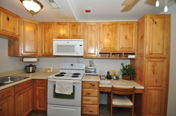 Heritage Park Senior Apartments Kitchen & Desk Heritage Park Senior Apartments Kitchen & Desk - Norco CA - Photo Gallery 4