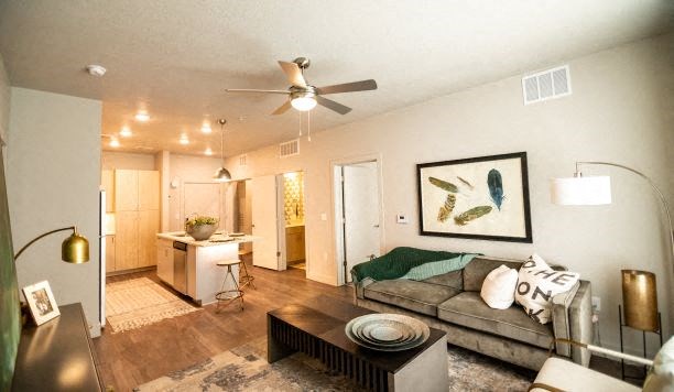 Living Room With Kitchen View at Soleil Lofts Apartments, Herriman, Utah