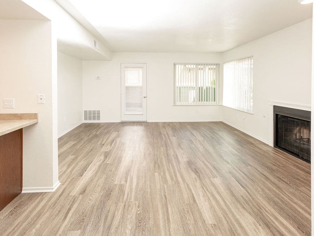 Spacious Apartments with Woodgrain Flooring & Fireplace t River Oaks Apartments & Townhomes, Hanford, California