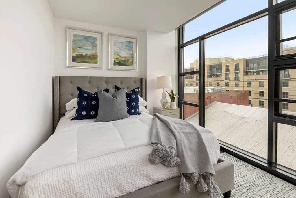 Bedroom with floor to ceiling windows