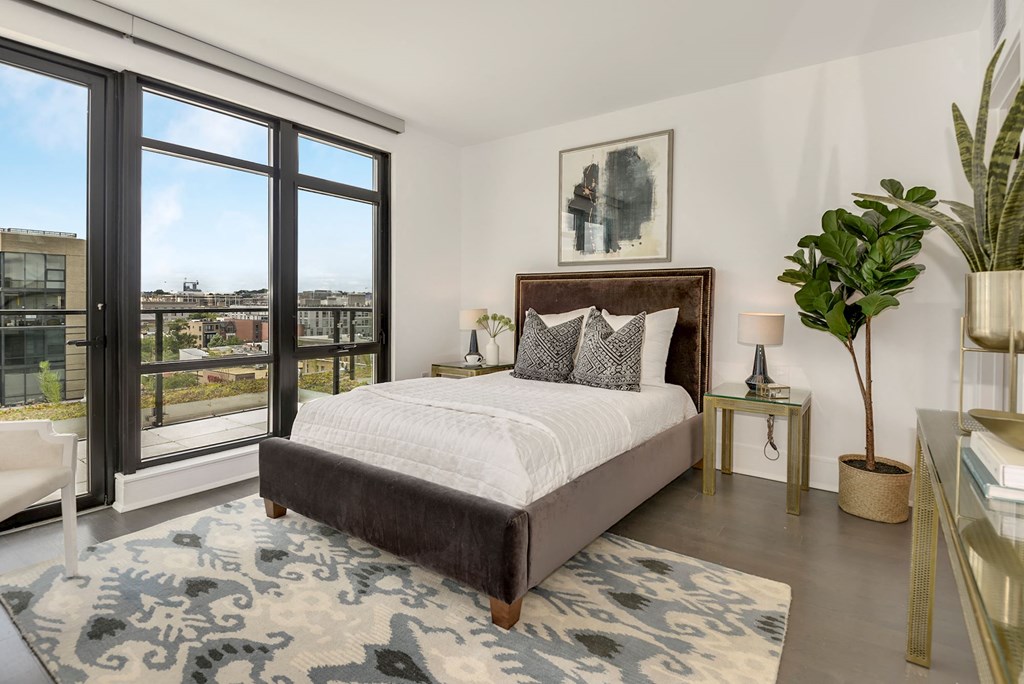 Bedroom with floor to ceiling windows