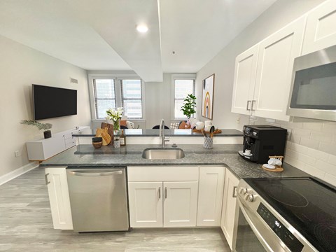 a kitchen with a counter top and a sink