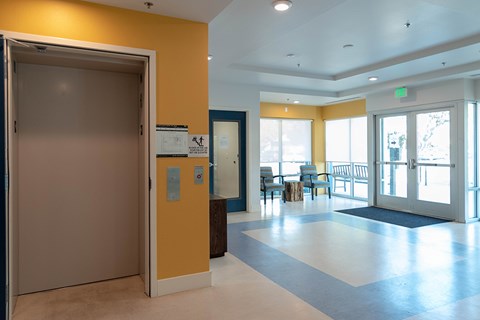 A hallway with a blue and white checkered floor.
