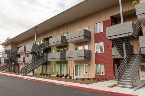 Apartment complex with staircases leading to the upper floors.