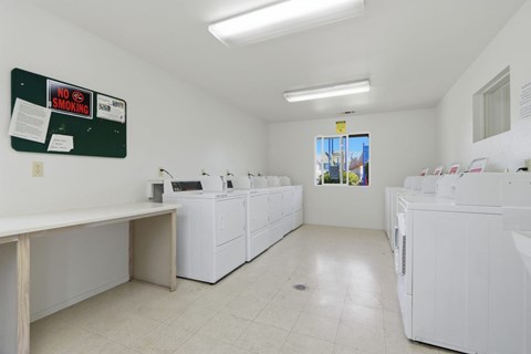 A laundromat with a "No Smoking" sign on the wall.