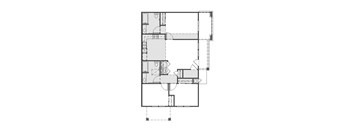 A floor plan of a house with a kitchen, living room, and two bedrooms.