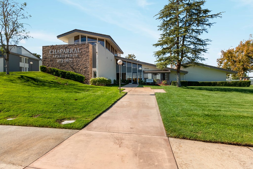 A building with the sign Chaparral Apartments on it at Chaparral Apartments, Palmdale, California