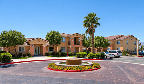 A building with a fountain in front of it.