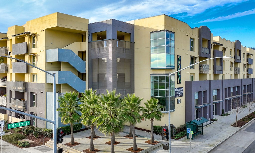 a building with palm trees in front of it
