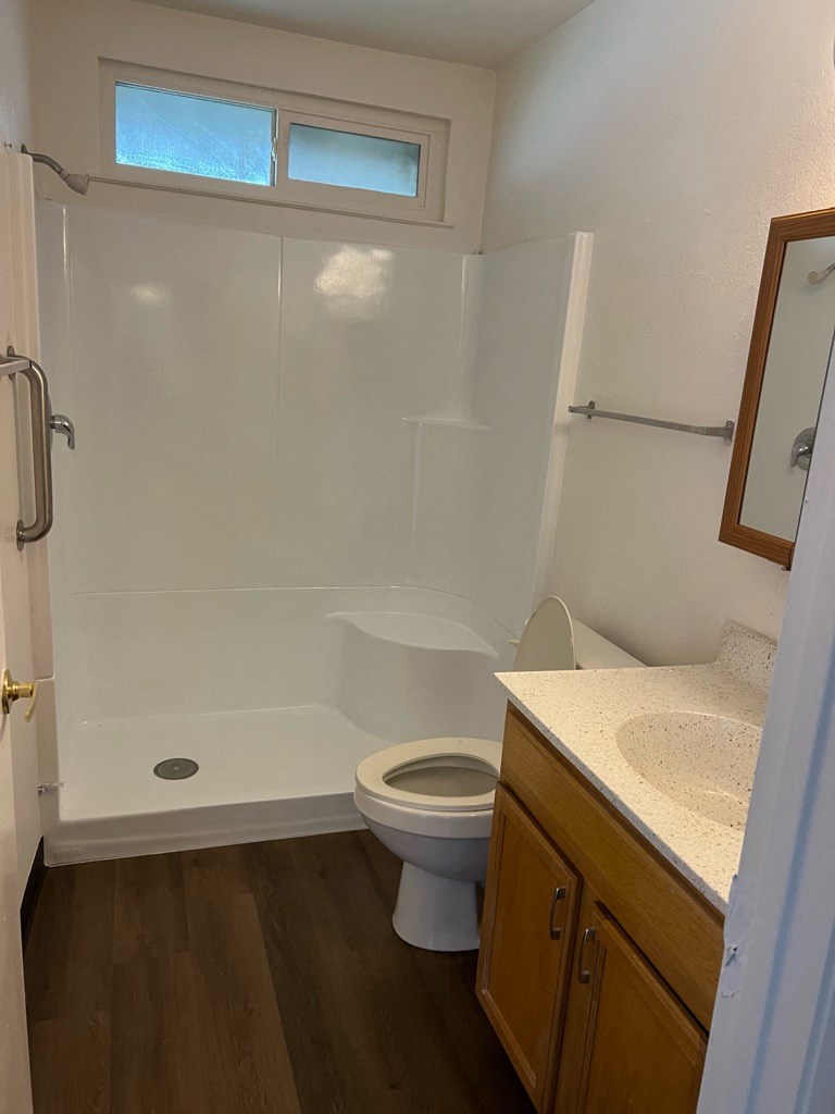 a small bathroom with a toilet and a shower