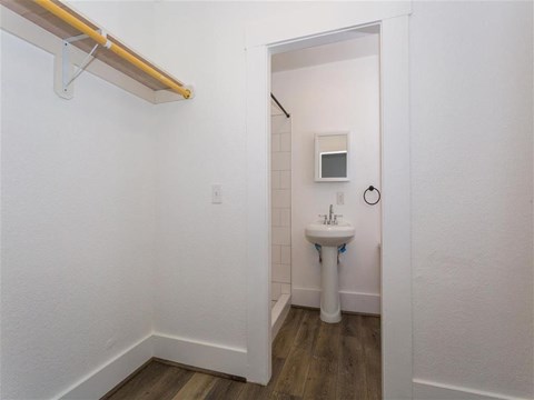 Closet with view of bathroom