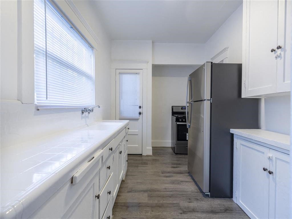 Kitchen view with stainless steel fridge