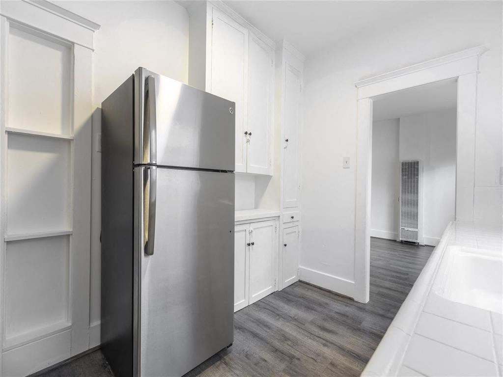 Kitchen view with stainless steel fridge